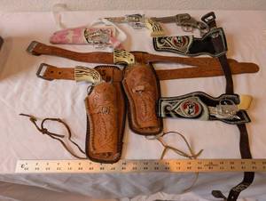 lot 173 image: Vintage Die-Cast Toy Cap Guns with Tooled Leather and Western Holsters Lot