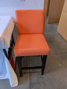 lot 217 image: Orange Faux Leather Counter Stool with Black Wood Legs