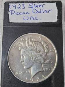 lot 76 image: 1923 Silver Peace Dollar - Unc. -  Black Slab