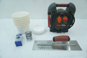 lot 7 image: NEWLIKE NEW Black & Decker 300A Jump Starter, Trowel (used), Universal Cement, CHEMbond Round Patches, Planters