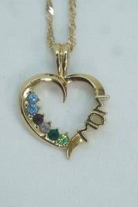 lot 86 image: Mothers Necklace. (14K Chain, heart pendant testes as Gold)
