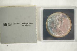 lot 111 image: 1985 Canadian Proof Silver Dollar Coin in case. Commemorating the 100th Anniversary of Canadas National Parks
