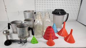 lot 6 image: Assorted Wax and Soap Preparation Items including Aluminum Pitchers, Glass Bottles, and Funnels