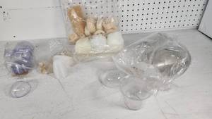 lot 10 image: Lot of Various Plastic Containers and Bath Accessories such as clear cups, lids, loofahs, and bath sponges