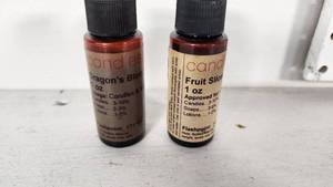 lot 56 image: Dragons Blood and Fruit Slice Fragrance Oils 1 oz Bottles Both Nearly Full