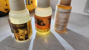 lot 79 image: Fragrance Oils including Midnight Lounge and US-470 Black 1 oz Bottles Partially Full