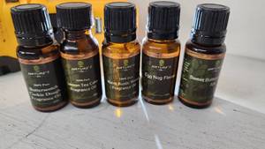 lot 81 image: Natures Oil Fragrance Oils including Butterscotch, Lemon Tea Cake, Warm Rustic Woods, Egg Nog 12 oz Bottles Near Full