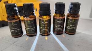 lot 82 image: Lot of Natures Oil and Edens Garden Fragrance Oils Orange Peel, Candy Apple Caramel,Egyptian Dragon, Malibu Rum Cake, Cozy Cottage - All partially Full