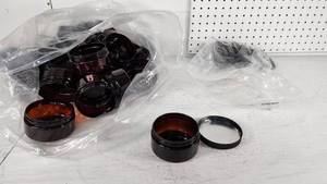 lot 105 image: Amber Plastic Jars with Lids - 3 14 Diameter, 1 34 Tall - Only a couple lids - 31 Plastic Jars