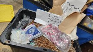 lot 115 image: Decorative shreds, tissue paper and packing materials in a container