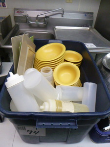 lot 94 image: Tote of Bowls and Squeeze Bottles