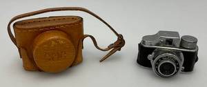 lot 114 image: Est. $90.00 To $175.00 Vintage Miniature C.M.C. Spy Camera In Original Case And Has Original Unused Film Roll Made In Japan (New Old Stock)
