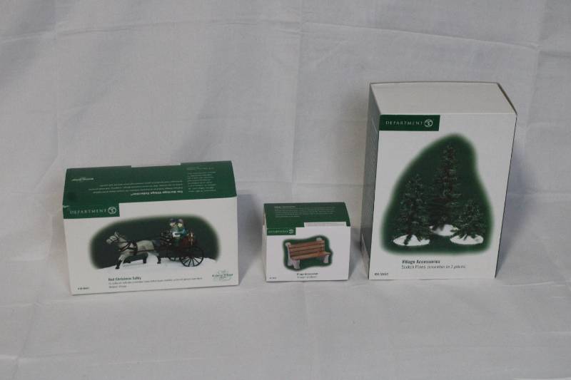 lot 69 image: Department 56 Heritage Village Accessories Lot, Red Christmas Sled, Wooden Park Bench, Sisal Pine Trees