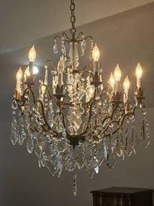 lot 1 image: Elegant 12-Arm Crystal Chandelier with Bronze Finish Frame