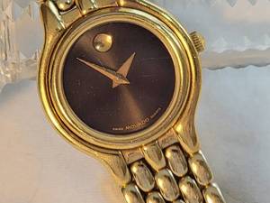 lot 70 image: Movado Museum Watch with Black Dial and Panther-link Bracelet
