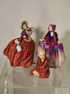 lot 156 image: Group of Royal Doulton Hand-Painted Porcelain Figures