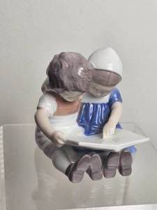 lot 195 image: Bing & Grondahl Copenhagen Porcelain Children Reading Figurine