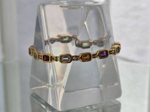 lot 71G image: Refined 18K Yellow Gold Multi-Gemstone Bezel-Set Link Bracelet with Emerald, Garnet, Amethyst and Citrine Accents 16 Grams, 7 Inches