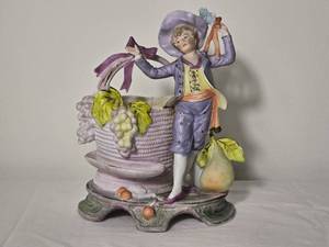 lot 237 image: Vintage Porcelain Boy with Basket Figural Planter