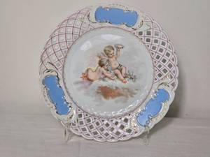 lot 241 image: Decorative Openwork Porcelain Plate with Cherub Scene