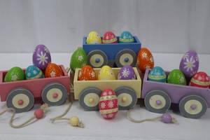 lot 64 image: Midwest Wooden Wagons Carrying Painted Easter Eggs