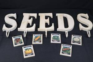 lot 86 image: Vintage Seed Packet Wall Art - SEEDS Letter Wall Hooks