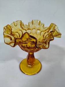 lot 103 image: Fenton Thumbprint Amber Glass Ruffled Pedestal Candy Dish