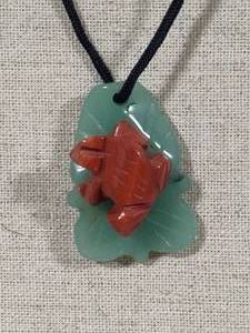 lot 65 image: Hand Carved Adventurine Frog on Jade Lily Pad wRope Necklace