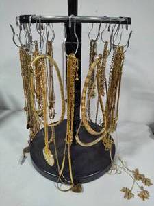 lot 107 image: Gold Tone Costume Necklaces wDisplay Spinner