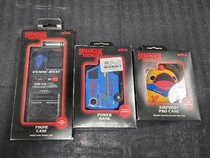 lot 128 image: Stranger Things Code Red - Air Pods Pro Case, Power Bank and iPhone 16 Phone Case