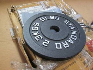 lot 242 image: 4 weight plates, 5 lb each...
