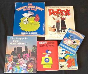 lot 404K image: BR1 - Vintage Childrens Books Lot - Snoopy Come Home Movie Book, The Muppets Take Manhattan, Snoopy and the Red Baron, Sleeping Beauty, Popeye, Dennis the Menace On the Go