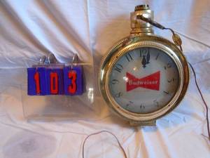 Budweiser pocket watch clock. Problably from the 1950's. Clock & spin motor work. As shown.