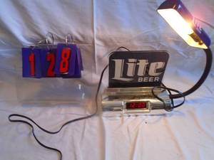 lot 128 image: Mille Lite register clocklight. Both work. Still has paper on tape. As shown.