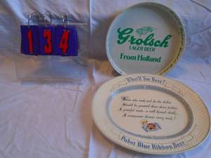 lot 134 image: Pabst oval tray plastic & Grolsch metal tray. Boot good condition. As shown.