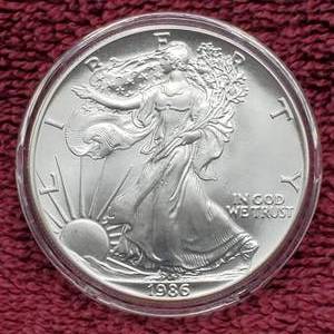 lot 4 image: 1986 American Silver Eagle in Airtite--1st Year of Issue
