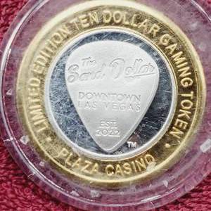 lot 105 image: Plaza $10 Gaming Token in Airtite--Center is .60 toz. of .999 Silver