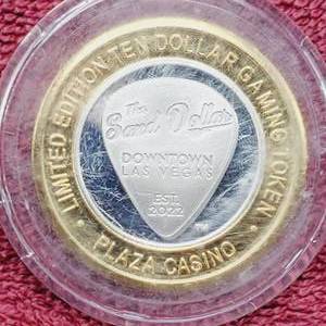 lot 106 image: Plaza $10 Gaming Token in Airtite--Center is .60 toz. of .999 Silver