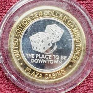 lot 108 image: Plaza $10 Gaming Token in Airtite--Center is .60 toz. of .999 Silver