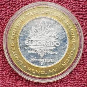 lot 112 image: Gaming Token in Airtite--Center is .60 toz. of .999 Silver