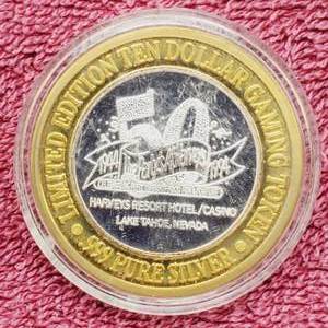 lot 113 image: Gaming Token in Airtite--Center is .60 toz. of .999 Silver