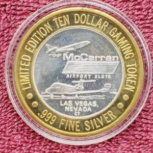 lot 114 image: Gaming Token in Airtite--Center is .60 toz. of .999 Silver