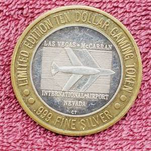 lot 115 image: Gaming Token--Center is .60 toz. of .999 Silver