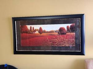 lot 11 image: Framed Landscape Wall Art - Rural Red Field Scene with House, Black Frame