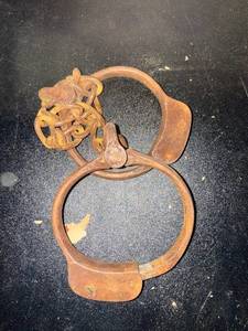 lot 443 image: Antique Iron Leg Irons Shackles with Chain - Rusty Pair