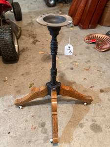 lot 487 image: Vintage Pedestal Stand with Circular Candle Holder Top on Four-Wheel Wooden Base