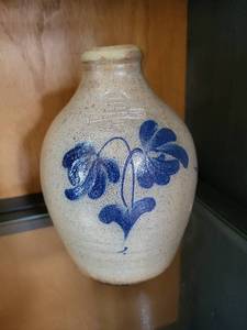 lot 8 image: Antique Stoneware Jug by Cowden & Wilcox Harrisburg with Blue Floral Design