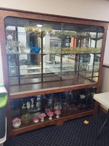 lot 139 image: Large Glass Display Cabinet with Sliding Doors and Shelves, 71x19x75 Inches