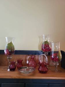 lot 300 image: Set of 7 Cranberry Glass Pitchers, Basket, Bowls, and Hurricane Vases