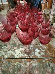 lot 402 image: Set of Ruby Red Stemmed Glasses with Textured Stems